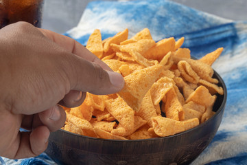 crunchy corn cones snack on wooden bowl