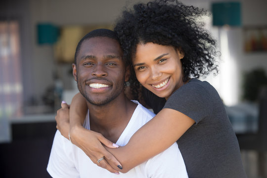 Head shot portrait of smiling African American couple in love