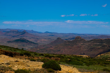 Open African landscape during day time with mountains and clouds, Lesotho