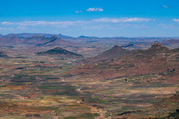 Open African landscape during day time with mountains and clouds, Lesotho