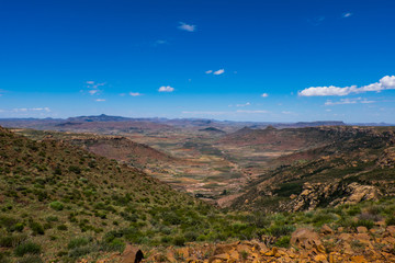Open African landscape during day time with mountains and clouds, Lesotho