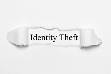 Identity Theft on white torn paper