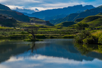 Fototapeta na wymiar Landscape photo of lake in the mountains with reflection in the water, South Africa, Africa
