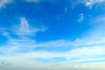 Naklejka na ściany i meble White Light clouds in the blue sky.