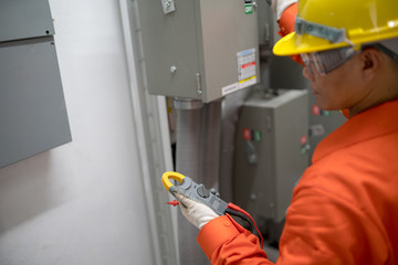 Electrical engineer inspects the electrical system in the building.
