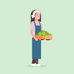 female farmer holding box with green ripe apples woman harvesting fruits agricultural worker eco farming concept flat full length