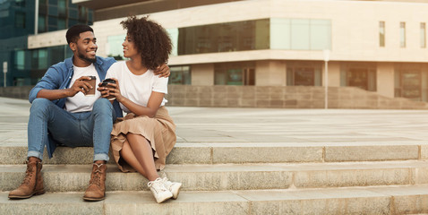Couple date. Man and woman drinking coffee outdoors