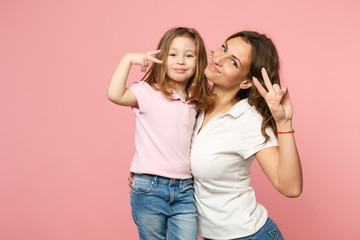 Woman in light clothes have fun with cute child baby girl. Mother, little kid daughter isolated on...