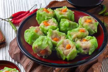 Chinese steamed pork dumpling dim sum on plate