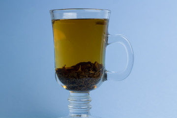 Tea in a beautiful cup on the leg