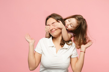 Woman in light clothes have fun with cute child baby girl. Mother, little kid daughter isolated on...