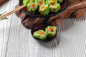 Chinese steamed pork dumpling dim sum on plate