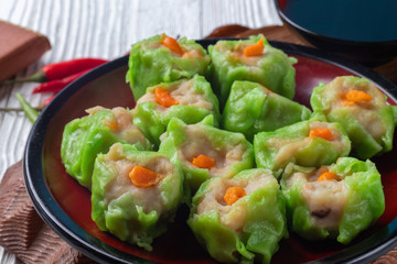 Chinese steamed pork dumpling dim sum on plate