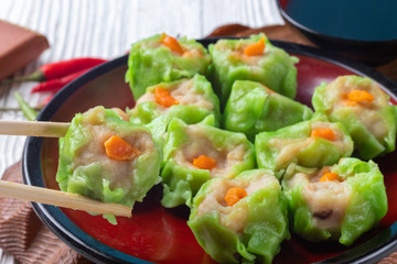 Chinese steamed pork dumpling dim sum on plate