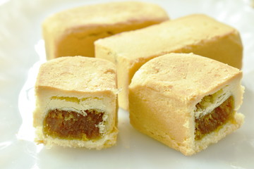 indigenous pineapple cake half cut on plate