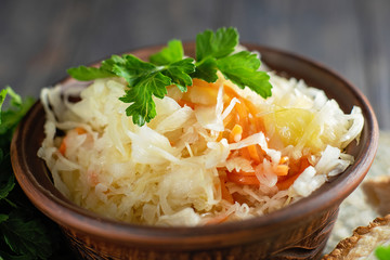salad homemade sauerkraut in a glass jar on a table