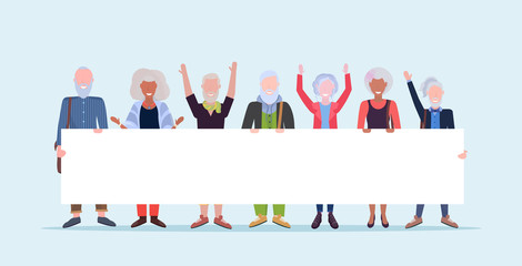 mature men women standing together holding empty placard sign board demonstration concept senior gray haired mix race people male female cartoon characters full length horizontal