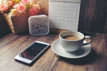 Desktop Calendar 2019,smart phone and clock place on wooden office desk.Calender for Planner timetable,agenda appointment,organization,management on table.Calendar Background Concept.