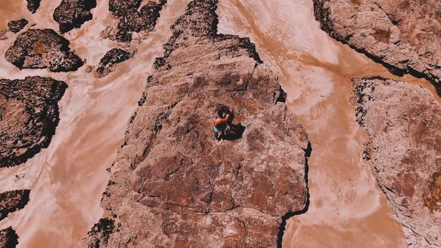 Aerial drone footage of couple alone at beach zooming out to reveal the exotic landscape, 4k, bay of islands, new zealand