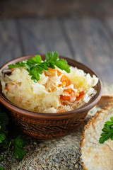 salad homemade sauerkraut in a glass jar on a table
