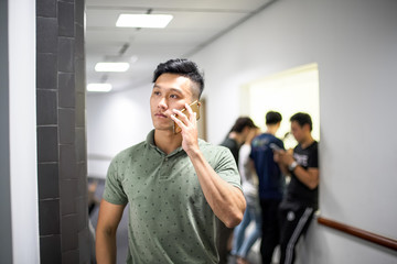 Asian handsome men talking happily on the phone | Guy smile while using smartphone