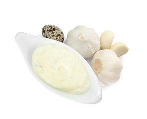Fototapeta na wymiar Gravy boat of sauce, garlic and quail egg isolated on white, top view