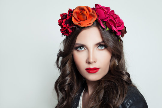Stylish woman with red lips makeup. Girl in flower crown portrait