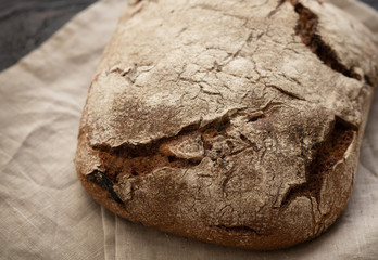 homemade bread is lying on a wooden table