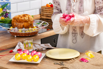 Person paint a egg made of polystyrene. Colorized acrylic egg