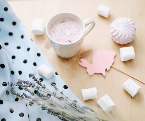 Fresh strawberry smoothie or milkshake with marshmallows, close-up. Easter concept. Creative spring flatlay, top view