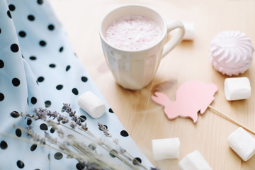 Fresh strawberry smoothie or milkshake with marshmallows, close-up. Easter concept. Creative spring flatlay, top view