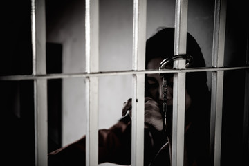 Hands of women desperate to catch the iron prison,prisoner concept,thailand people,Hope to be free.