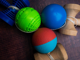 Traditional Japanese wood toy Kendama on wooden background, Symbol of Japanese boy toy.