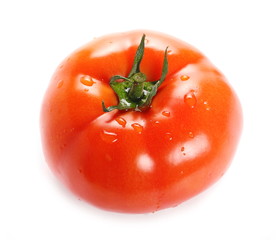 Fresh ripe red tomato with drops isolated on white background