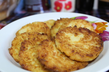 fried cottage cheese cheesecakes in a plate
