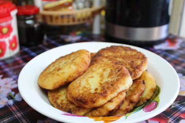 fried cottage cheese cheesecakes in a plate