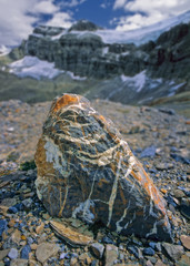 Striated Rock in glacial plain with Crowfoot Mountain beyond, Banff National Park, Canada