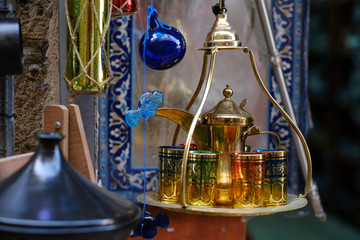 Fototapeta na wymiar Traditional arabic tea set and dried dates.Top view.