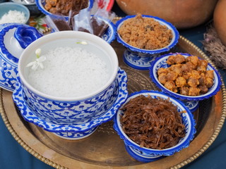 Khao Chae (rice in iced water with Jasmine flower) traditional Mon food  and many dessert in the plate.