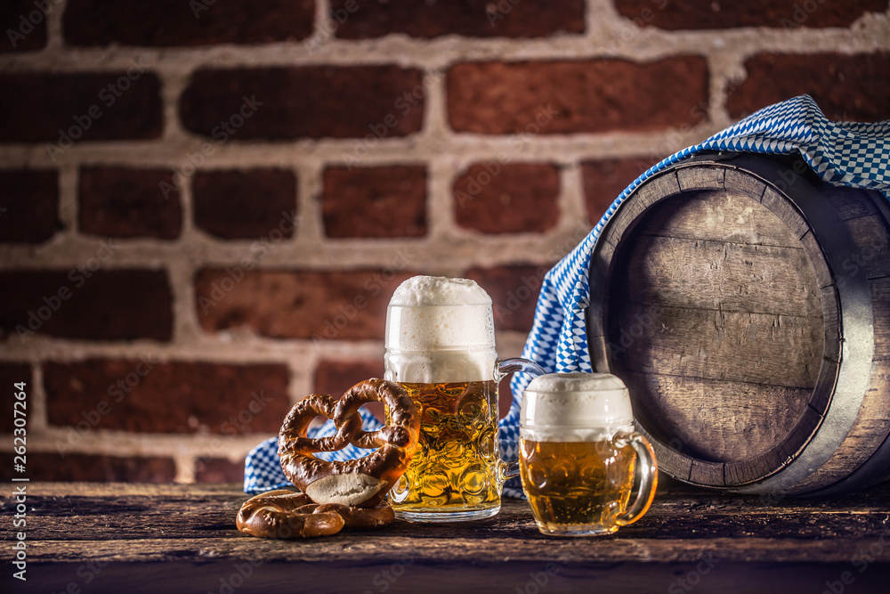 Wall mural Oktoberfest large and small beer with pretzel wooden barrel and blue tablecloth