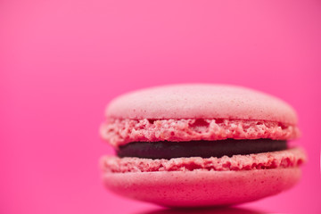Close-up macaron on magenta background