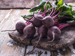 Freshly picked organic natural beet on a wooden board, background, copy space.