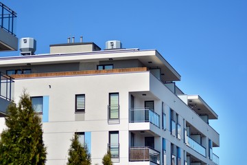 Modern apartment buildings on a sunny day with a blue sky. Facade of a modern apartment building