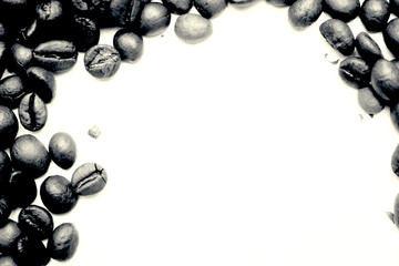 black and white. frame of coffee beans with space for text. view from above. coffee beans on a white background.