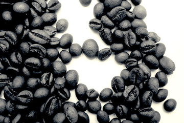 black and white coffee beans on a white background.