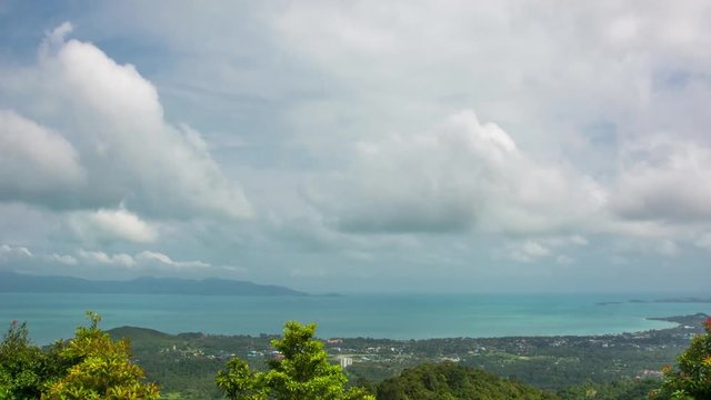 Time-lapse of running clouds over blue sky under Koh Samui MaeNam town