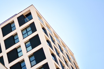 Modern apartment buildings on a sunny day with a blue sky. Facade of a modern apartment building