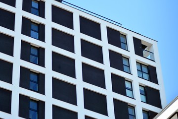 Modern apartment buildings on a sunny day with a blue sky. Facade of a modern apartment building