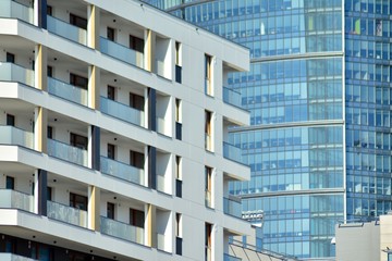 Modern apartment buildings on a sunny day with a blue sky. Facade of a modern apartment building