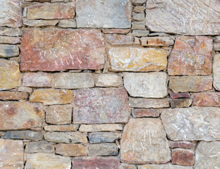 Fototapeta premium colorful stonewall close up, seamless natural background